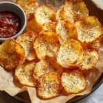 crispy cottage cheese chips on plate with dip